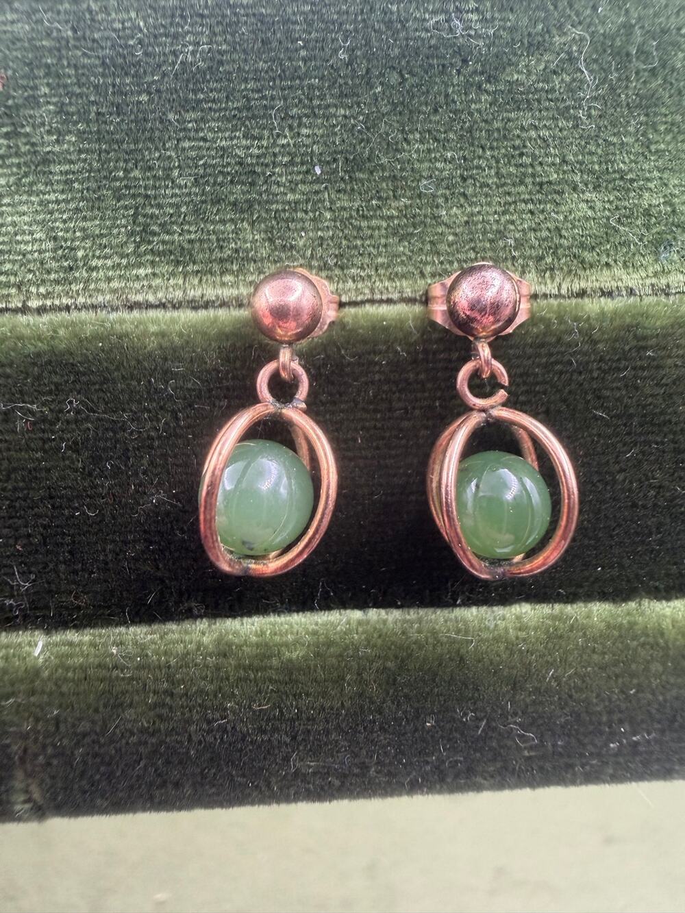 14k gold earrings jade beads suspended inside kinetic, rotating wire-frame cages